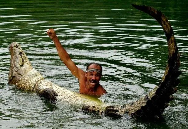 Costa-Rican-Chito and pocho-performs-in-a-lake-during-a-show-in-Siquirres